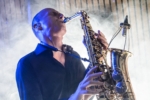 Arjan M palying Saxophone on stage