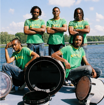 brazilian percussion band pose with their drums
